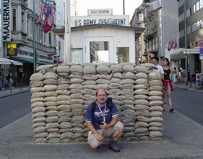 JC in front of Checkpoint Charlie